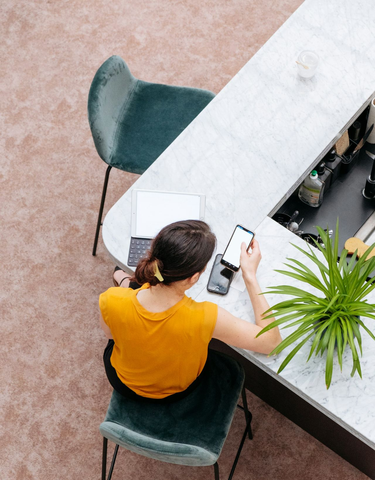 woman in yellow shirt sitting on chair